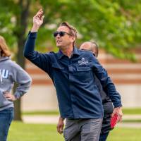 Bill Cuppy throws a bag during a game